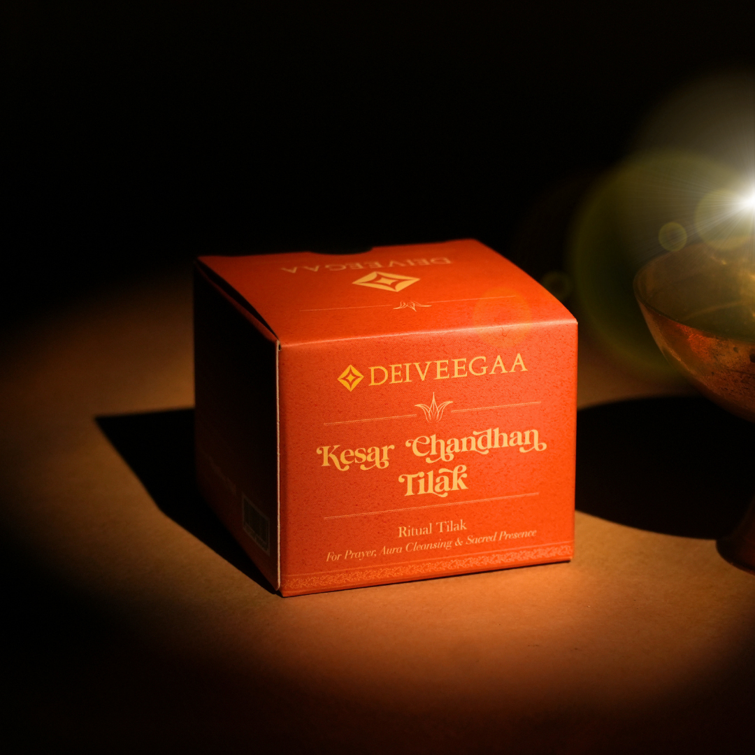 Deiveegaa Kesar Chandhan Tilak orange product box on a dark background