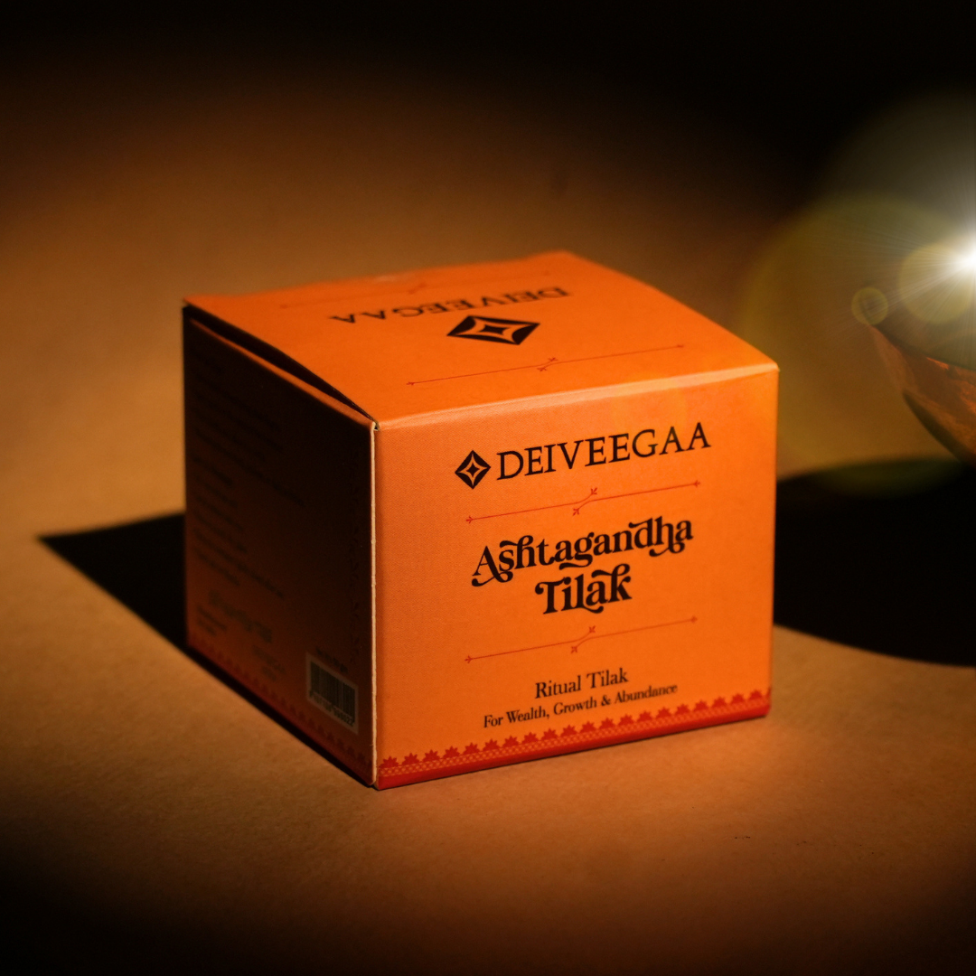 Deiveegaa Ashtagandha Tilak orange product box on a dark background